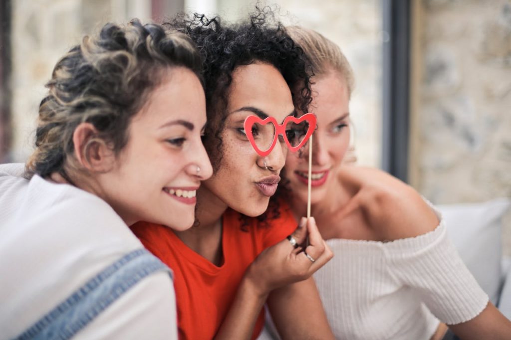 Three young women smiling