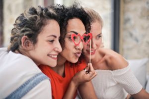 Three young women smiling